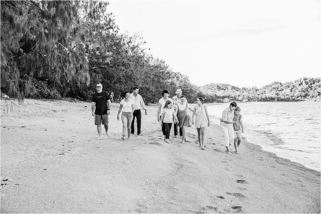 Large family walking on beach on Magnetic Island.