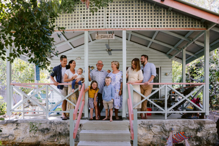 Three Generations of family gather on the front porch of the Magnetic Island holiday house.