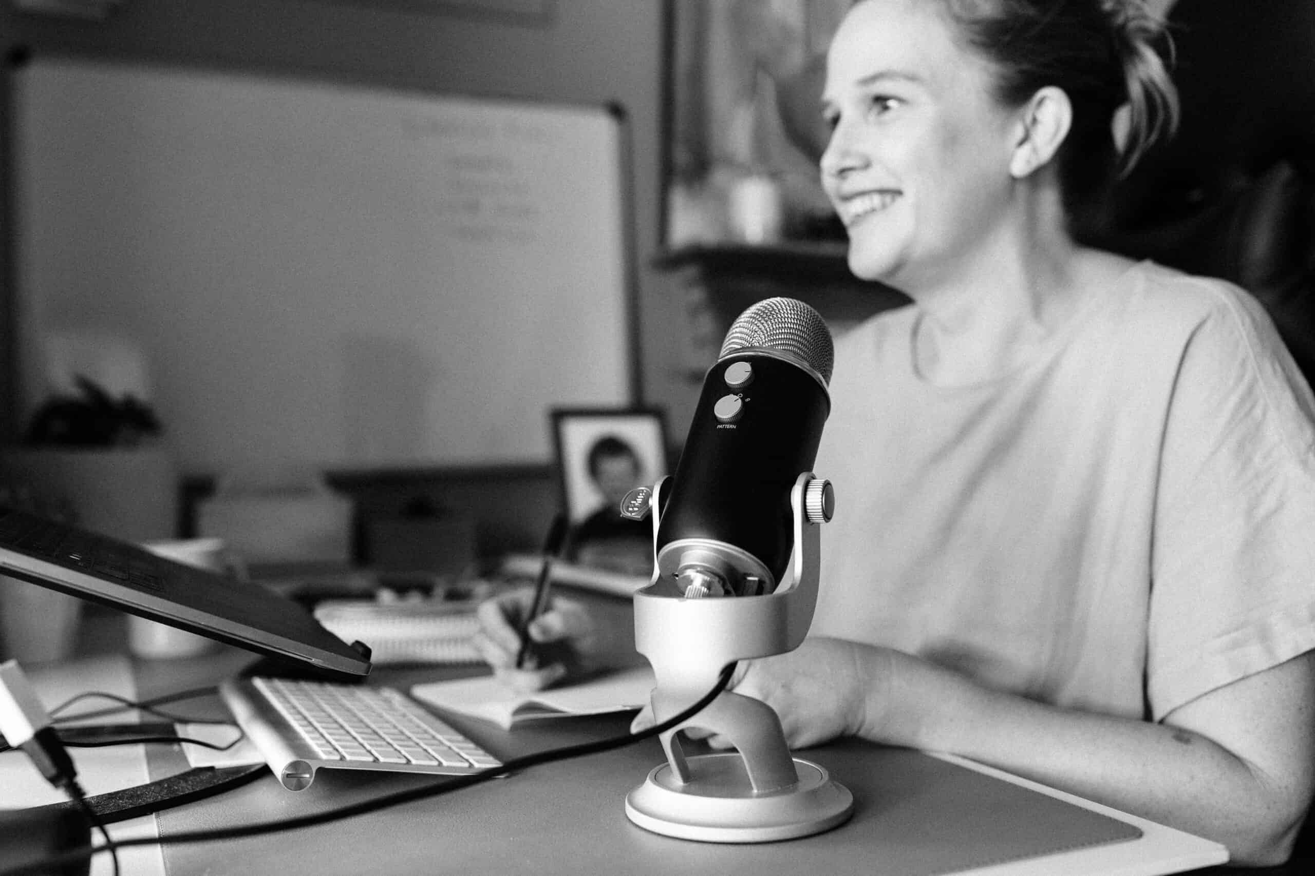 Black and white photo of Elle having a zoom meeting