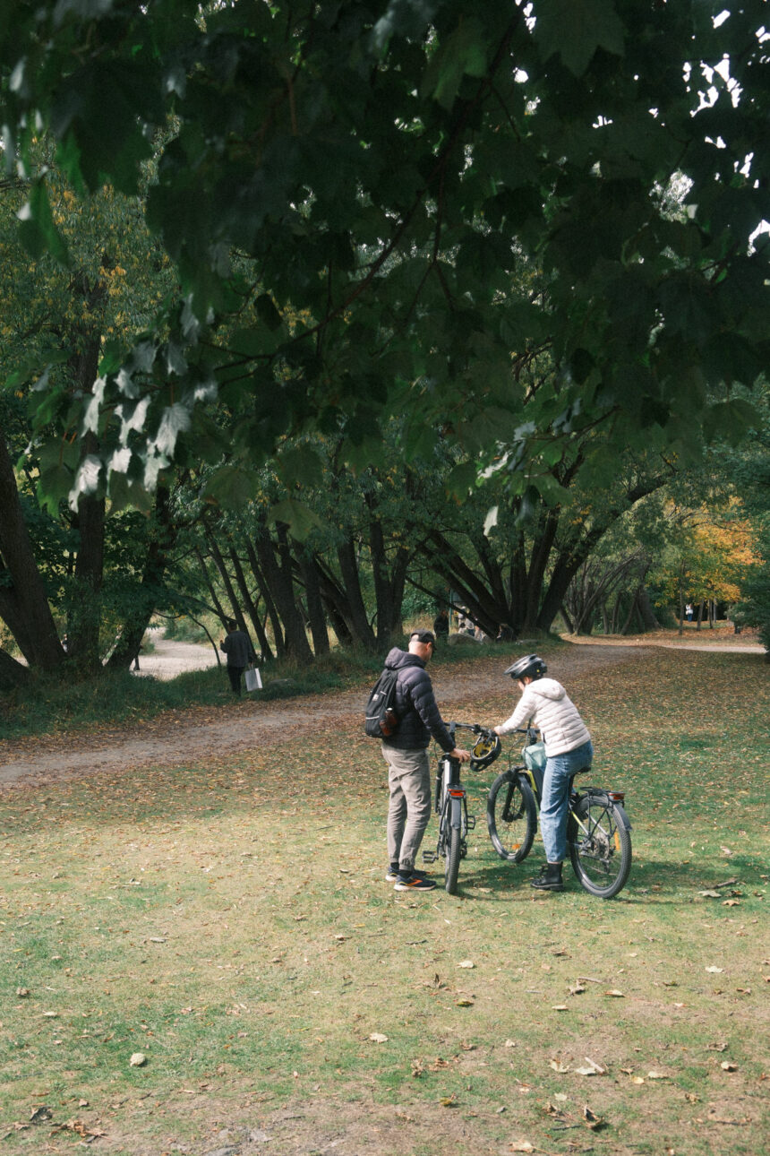 A father and daughter are on ebikes at Arrowtown