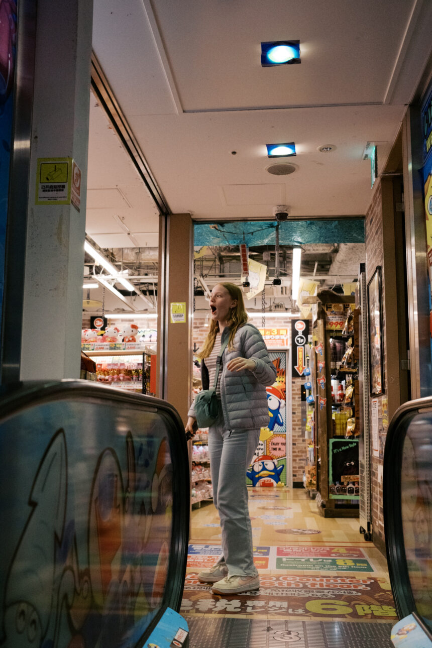 a teenage girl's face is full of excitement as she arrives at Don Quijote in Shinjuku for the first time