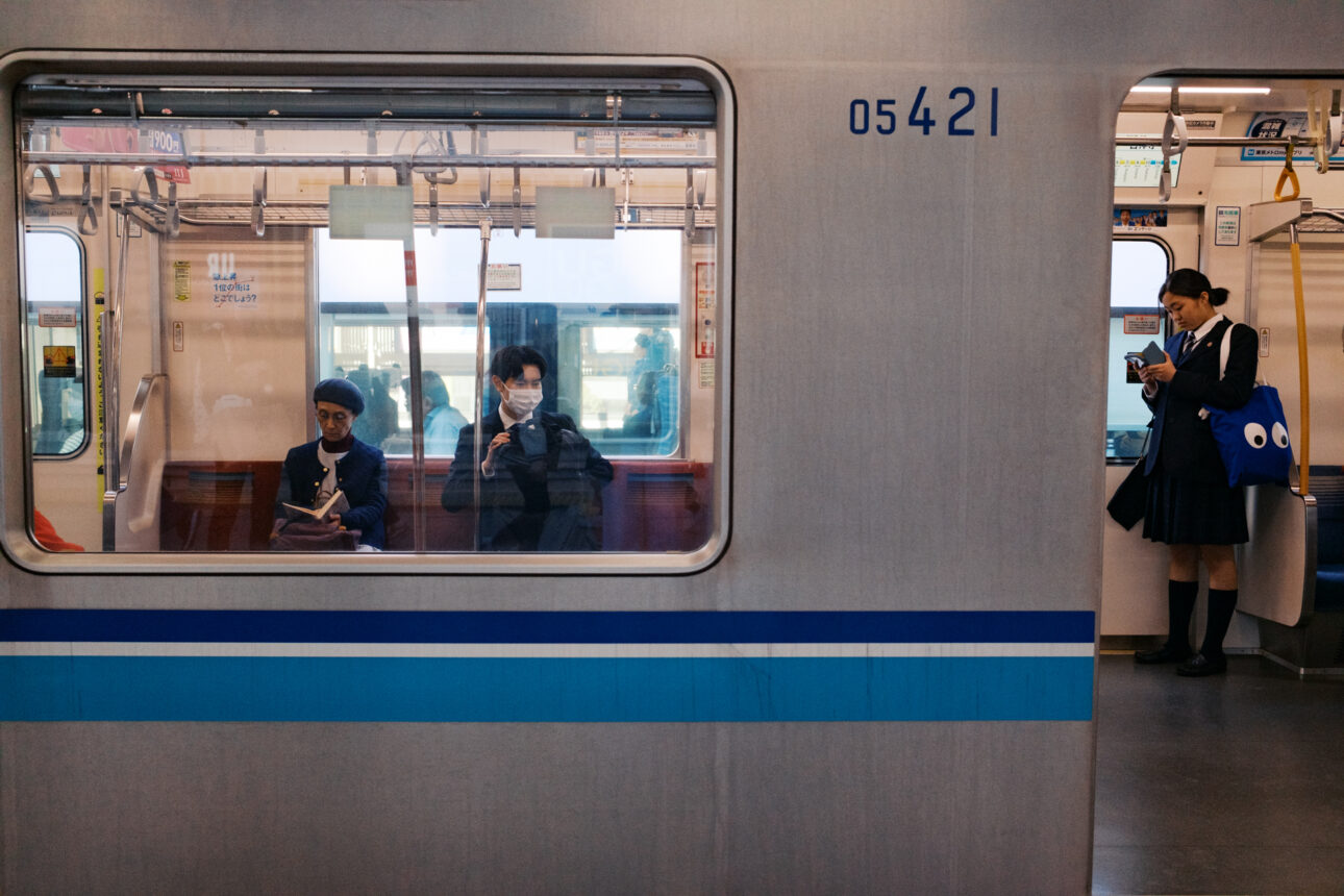 The view of a train in Tokyo from the platform as the doors close