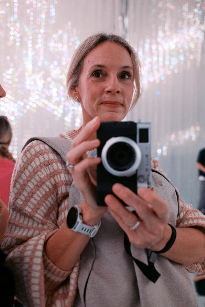 Katie takes a photo of her reflection at team labs Tokyo